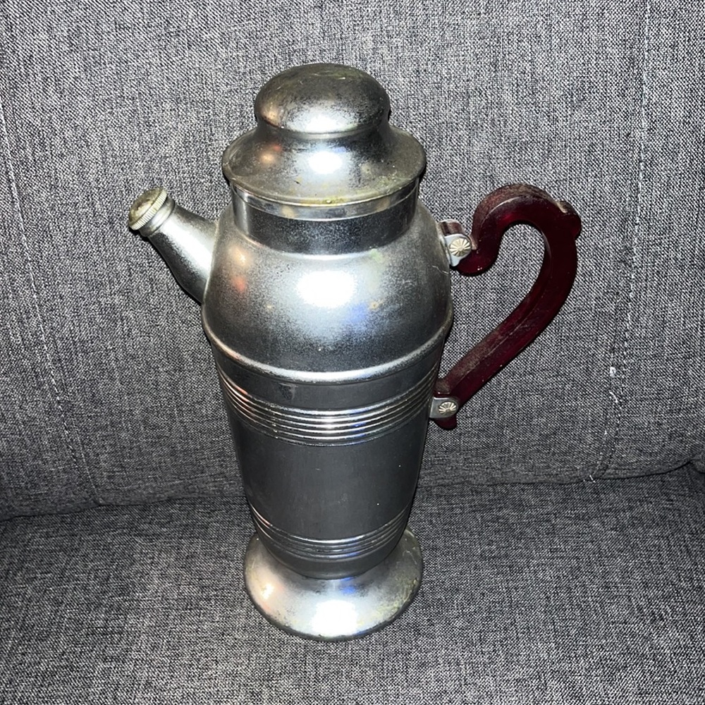 Mid century era, Art Deco style cocktail, shaker chrome, and ruby, red handle